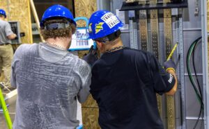 Two electrician apprentices use the BILT app for upskilling and workforce learning